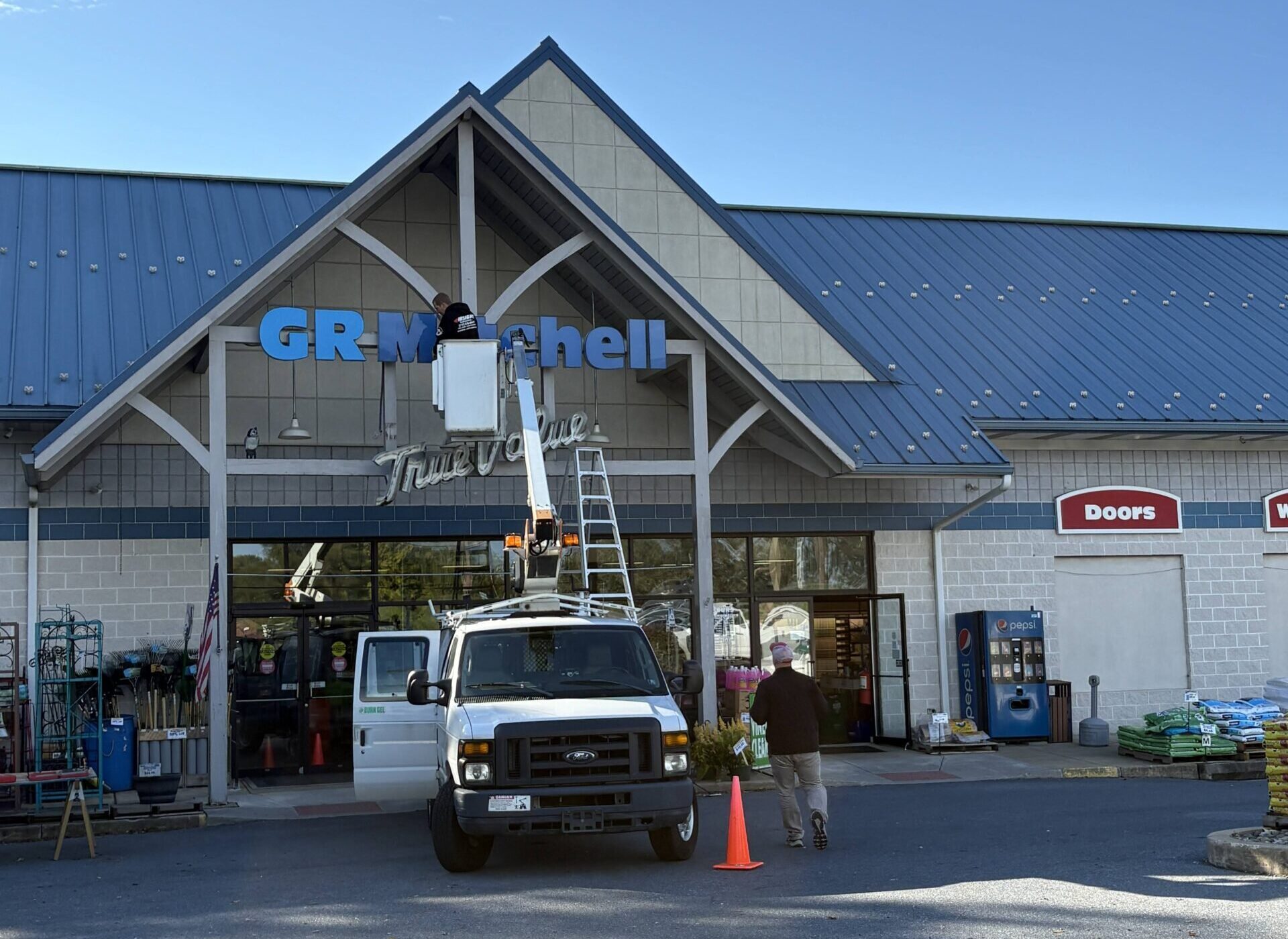 GR Mitchell Removes True Value sign from hardware storefront